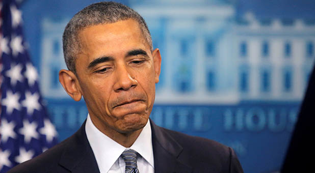 U.S. President Barack Obama pauses as he delivers a statement on the economy at the press briefing room at the White House in Washington