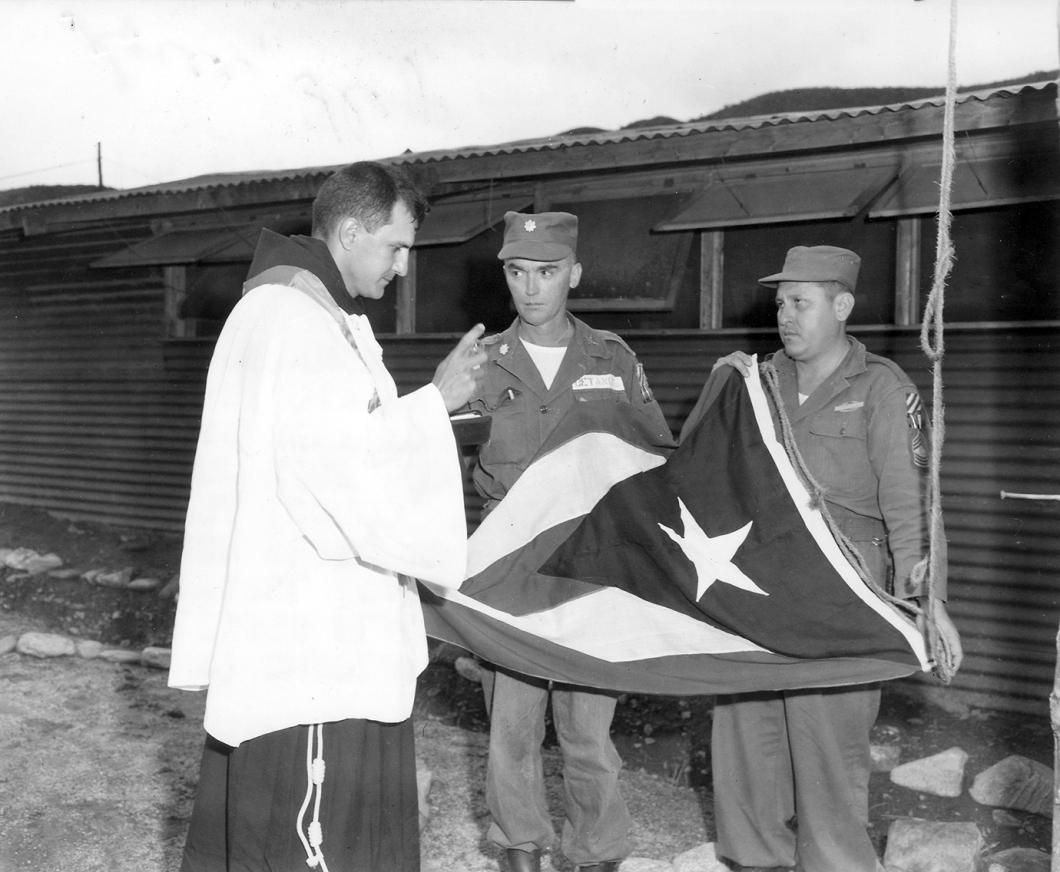 13. Chaplain blesses PR Flag in Korea 1952.300