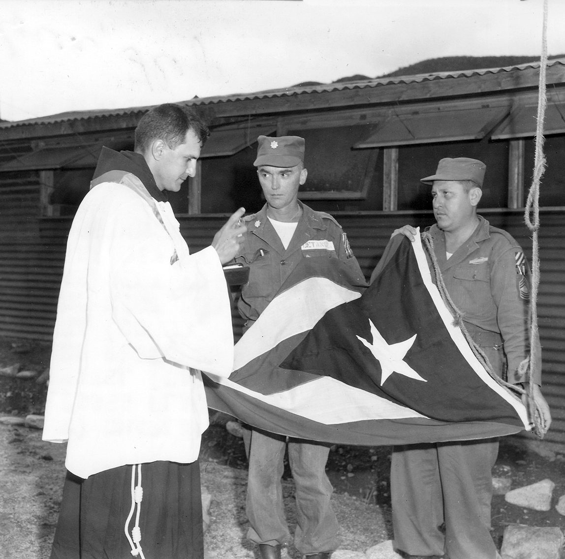 13. Chaplain blesses PR Flag in Korea 1952.300